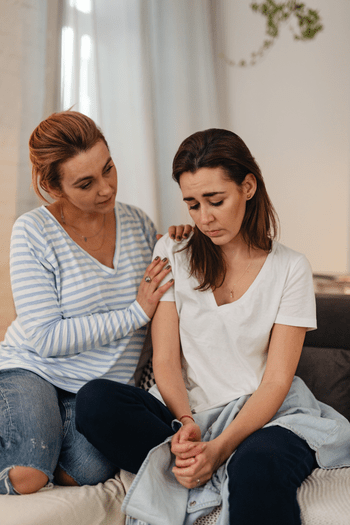 woman Comforting girl (350 px)_1 grief counseling, healing loss, death, sibling parent